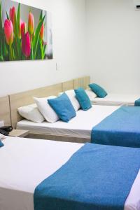 Ένα ή περισσότερα κρεβάτια σε δωμάτιο στο BGA Hotel