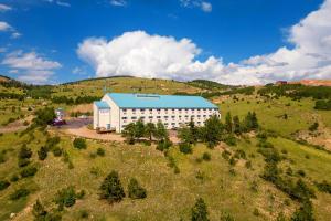 an aerial view of a building in a field at Golden Nugget & Gold King Mountain Inn in Cripple Creek