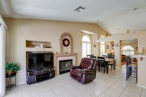 a living room with a fireplace and a television at North Las Vegas Home about 5 Mi to Fremont St! in Las Vegas