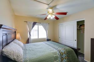 a bedroom with a bed and a ceiling fan at North Las Vegas Home about 5 Mi to Fremont St! in Las Vegas