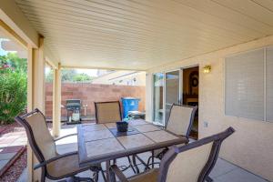 a porch with a table and chairs on a patio at North Las Vegas Home about 5 Mi to Fremont St! in Las Vegas
