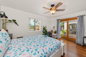 a bedroom with a bed and a ceiling fan at Casa Sur in Chula Vista +48 photos