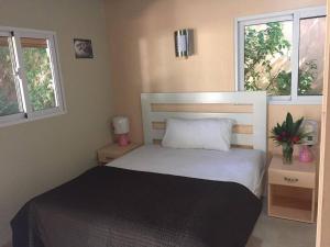 Postel nebo postele na pokoji v ubytování Villa Blind Spot