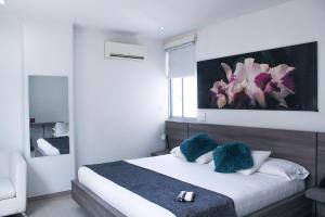 Ένα ή περισσότερα κρεβάτια σε δωμάτιο στο BGA Hotel
