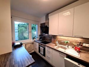 a kitchen with a sink and a counter top at Michael's City Retreat in Graz