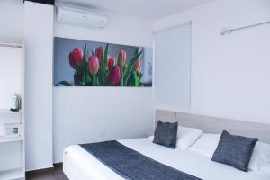 Ένα ή περισσότερα κρεβάτια σε δωμάτιο στο BGA Hotel