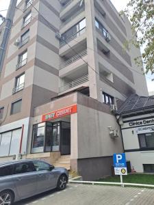 a car parked in front of a building at Rim1 in Piteşti