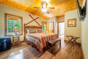 a bedroom with a bed and a ceiling fan at Large, Luxury, Views, Near Whiteface, Lake Placid in Wilmington