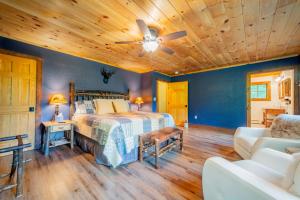 a bedroom with a bed and a wooden ceiling at Large, Luxury, Views, Near Whiteface, Lake Placid in Wilmington