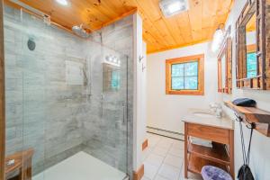 a bathroom with a shower with a glass shower stall at Large, Luxury, Views, Near Whiteface, Lake Placid in Wilmington +41 photos