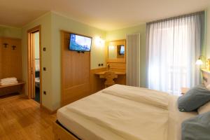 Postel nebo postele na pokoji v ubytování B&B Casa Agostini