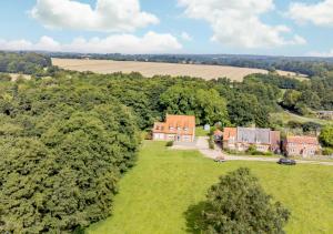an aerial view of a house in a field at Woodside in Thurgarton
