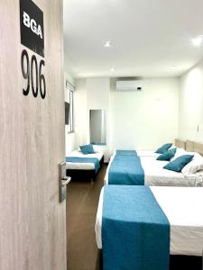 Ένα ή περισσότερα κρεβάτια σε δωμάτιο στο BGA Hotel