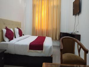 Asha Residency by StayApartにあるベッド