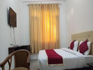 Cama o camas de una habitación en Asha Residency by StayApart