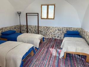 a room with two beds and a mirror at Farm’s guest room in Nuweiba