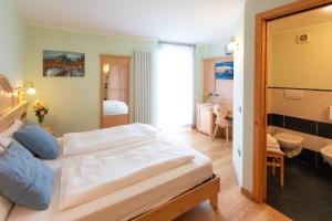 Postel nebo postele na pokoji v ubytování B&B Casa Agostini