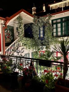 a building with ivy growing on the side of it at Check Point Hotel in Tbilisi City