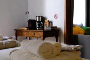 a room with a table with a towel on a bed at Trevi Little Palace #4 in Rome