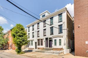 an apartment building on the corner of a street at Chic Philadelphia Townhome in University City! in Philadelphia