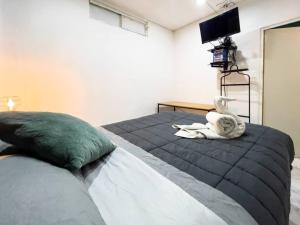 a bedroom with a bed with a stuffed animal on it at Cozy Apartment 10 min from downtown in San Luis Potosí