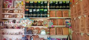 a display of china on a shelf in a store at Під горою 2 in Sheshory