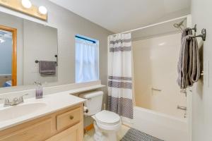 a bathroom with a sink and a toilet and a shower at Murphy Cabin with Deck and Sweeping Mountain Views! in Murphy +20 photos