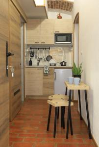 A kitchen or kitchenette at Podroom Apartments