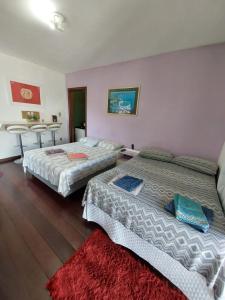 Postel nebo postele na pokoji v ubytování Residencial Rodrigues Centro Florianópolis