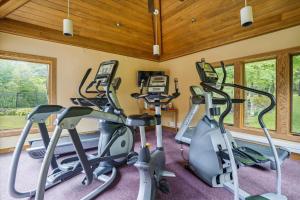 a gym with several exercise bikes in a room at Highridge B16A Hotel Room Only, Delightful hotel room, sleeps 2 in Killington