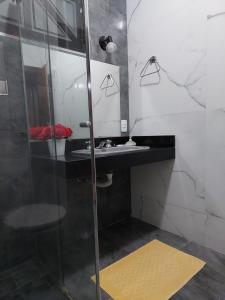 Ванна кімната в Espaço Aconchego