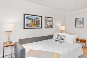 a bedroom with a bed and two pictures on the wall at Boomerang 203 - A Telluride Retreat in Telluride