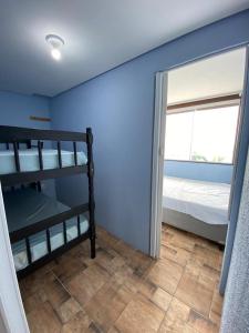 Cama ou camas em um quarto em Residencial Gralha Azul