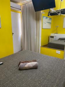 a pillow laying on the floor of a bedroom at Apartamento Avenida Atlântica in Rio de Janeiro