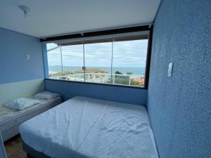 Cama ou camas em um quarto em Residencial Gralha Azul