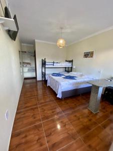 Cama ou camas em um quarto em Residencial Gralha Azul