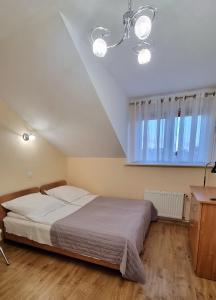Postel nebo postele na pokoji v ubytování Pokoje Basia