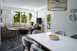 a living room with a table and chairs at Marriott's Ocean Pointe in Palm Beach Shores