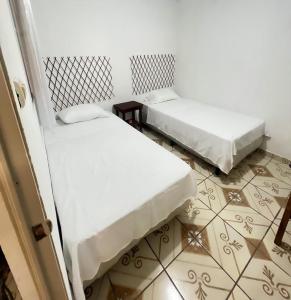 Cama o camas de una habitación en Hostal Villa Marta
