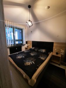 Postel nebo postele na pokoji v ubytování Aparthouse Zegrze