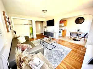 a living room with a couch and a table at Peaceful & Perfect Private 1-br I Lennox in Philadelphia