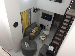 an overhead view of a living room with a couch and chairs at Happy Homes in Mombasa
