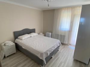Postel nebo postele na pokoji v ubytování Öz Ravza Apart