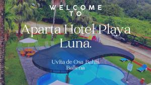 a sign that says welcome to aaraja hotel plaza luna at Apartahotel Playa Luna in Uvita