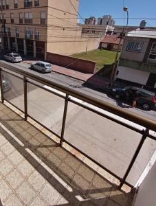 a view of a street with cars on the road at Nueva Hostería Rio Colorado Necochea in Necochea