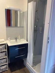 a bathroom with a sink and a shower at Authentic by Balladins, Le Carré d'Aix in Aix-les-Bains