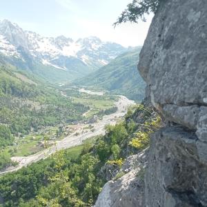 a view of a valley from a rocky mountain at Bujtina Albjoni in Valbonë