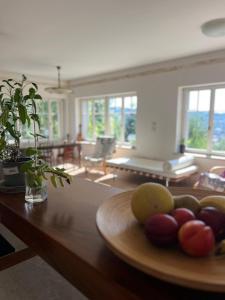 a plate of fruit on a table in a living room at Vila Bellevue in Jablonec nad Nisou