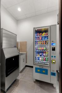 a kitchen with a refrigerator filled with drinks at Quality Inn Center City Philadelphia in Philadelphia