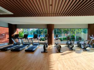 a gym with treadmills and elliptical machines at Budget Homestay by The RUM in Putrajaya